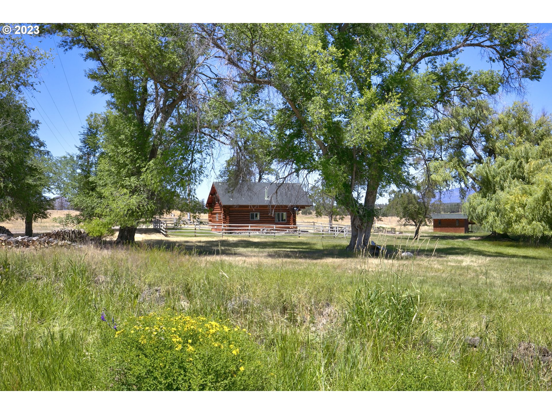 11677 Southwest Houston Lake Road Powell Butte, OR 97753 - Photo 31 of 35 a view of a house with a yard
