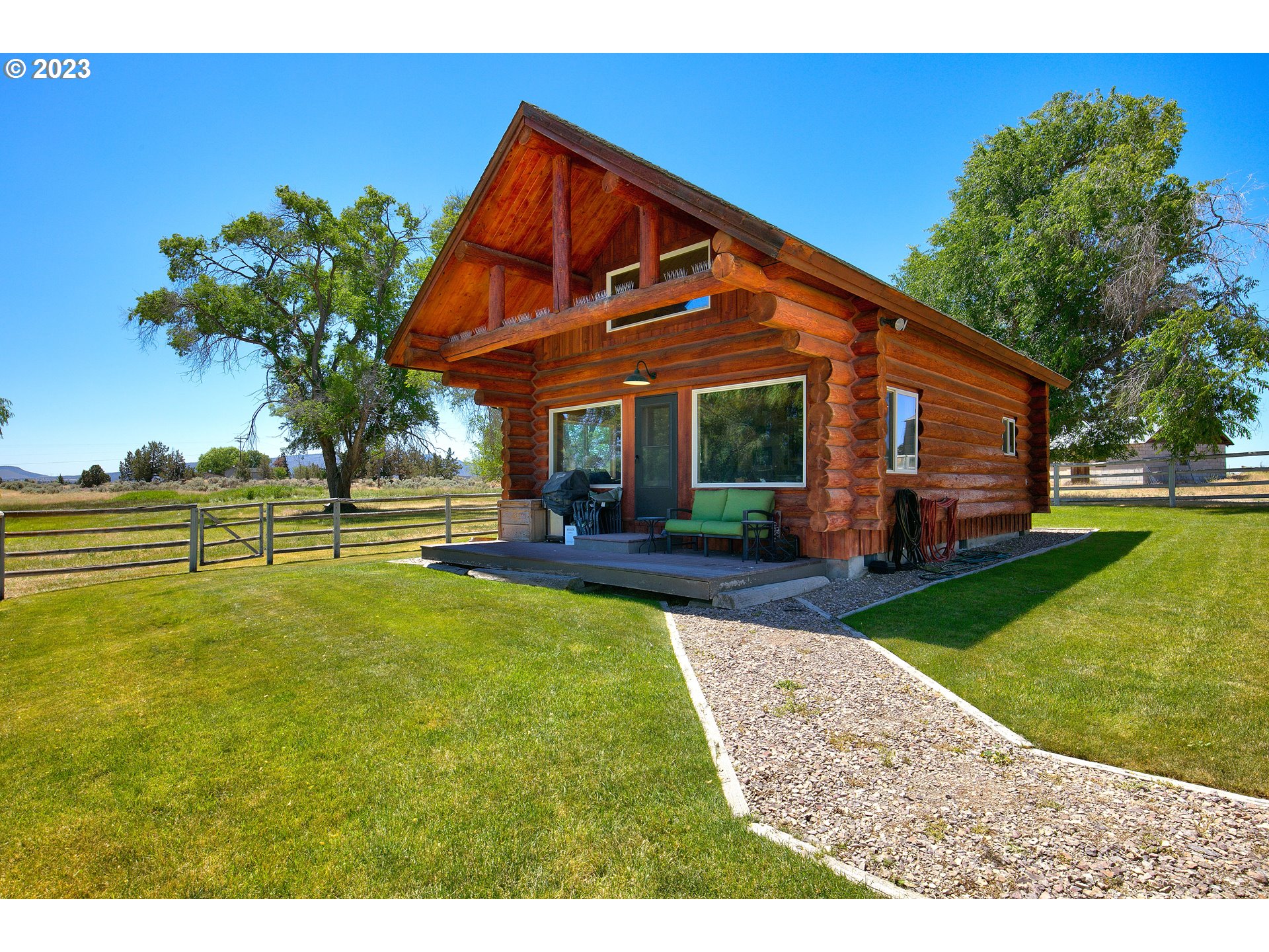 11677 Southwest Houston Lake Road Powell Butte, OR 97753 - Photo 6 of 35 a view of a house with backyard