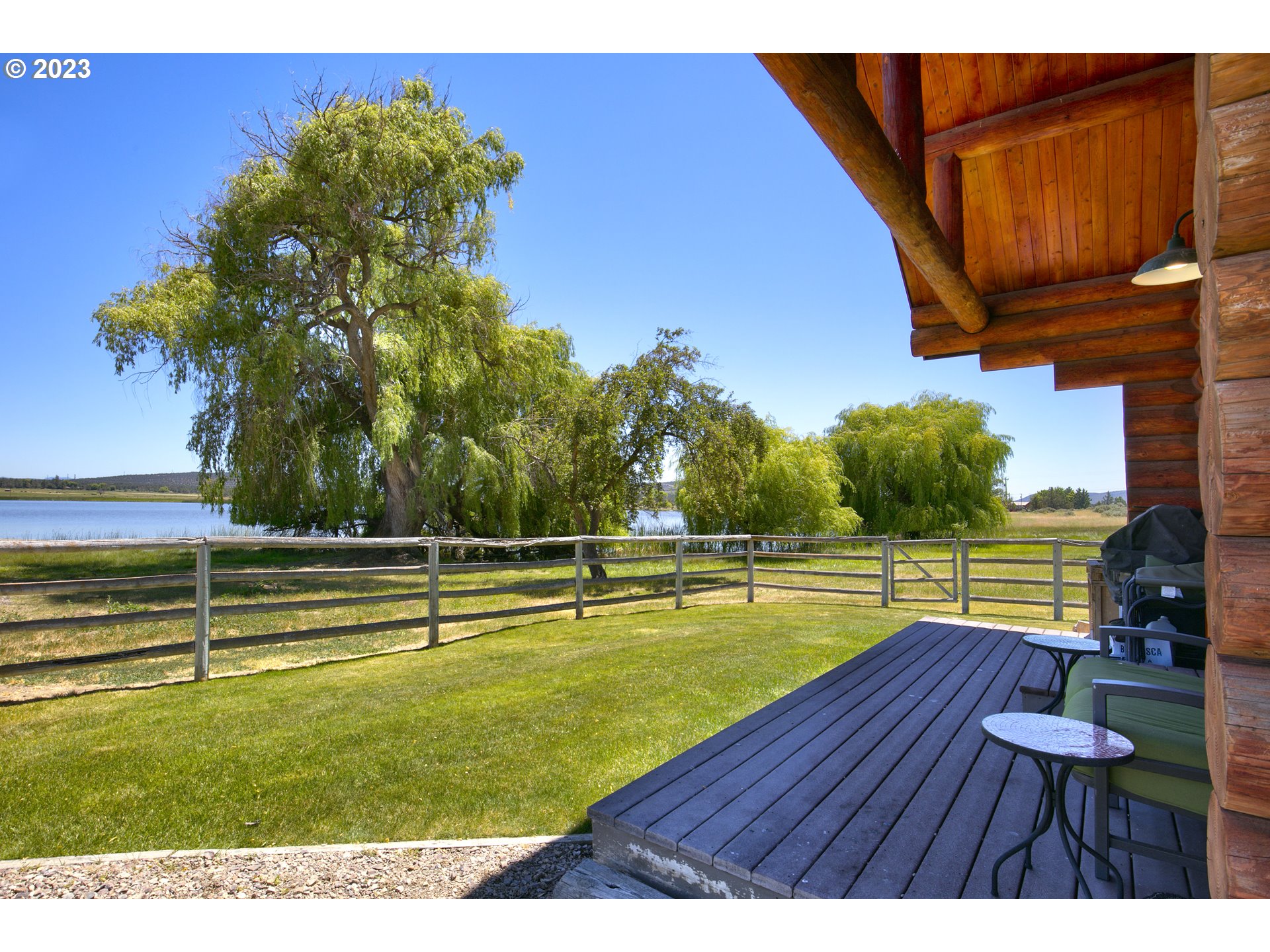11677 Southwest Houston Lake Road Powell Butte, OR 97753 - Photo 7 of 35 a view of swimming pool with outdoor seating and lake view