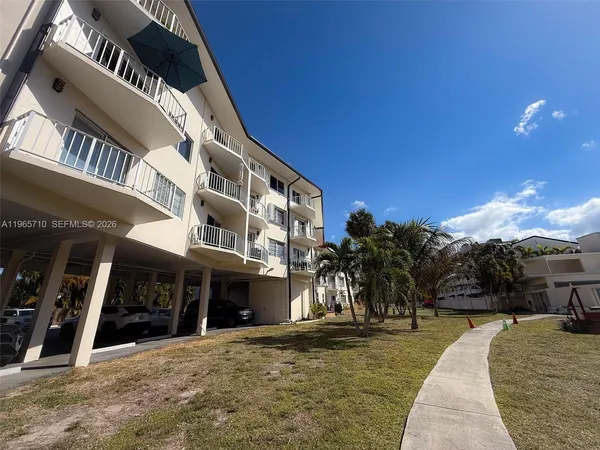 a bedroom with furniture and a flat screen tv