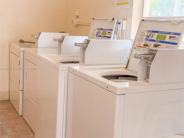 a room with gym equipment and a large window