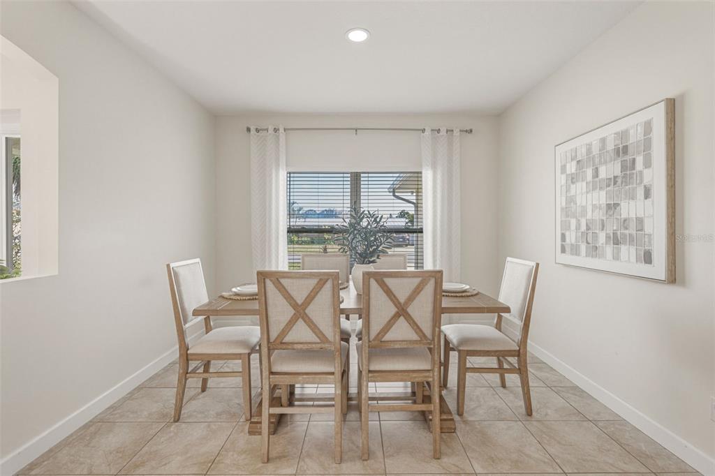 634 Carmel Road Venice, FL 34293 - Photo 12 of 67 a dining room with furniture and window
