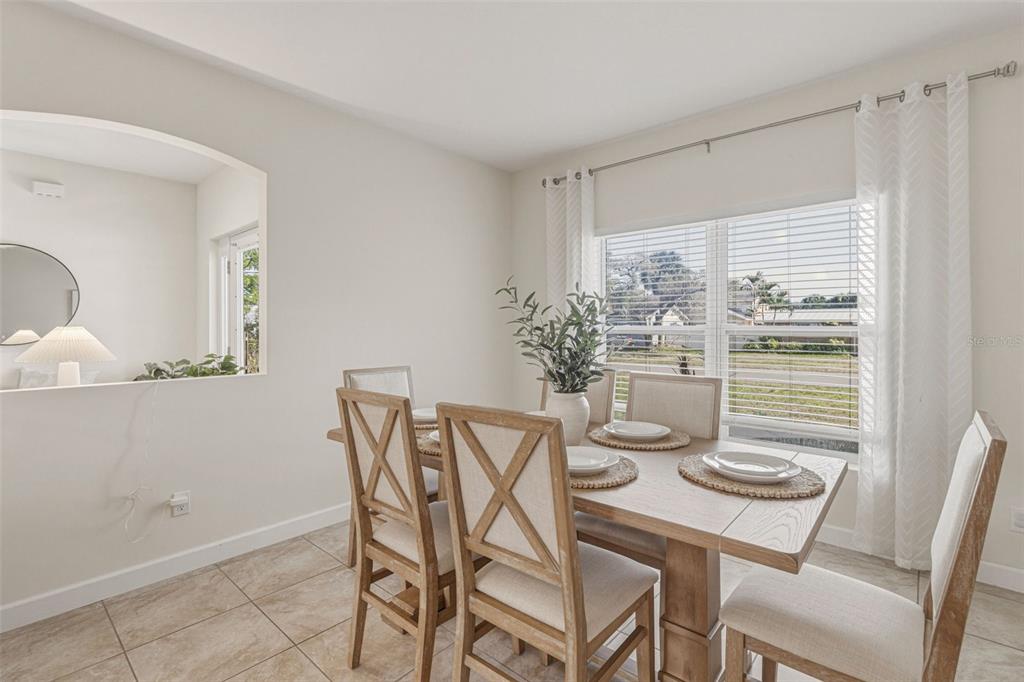 634 Carmel Road Venice, FL 34293 - Photo 13 of 67 a view of a dining room with furniture window and outside view