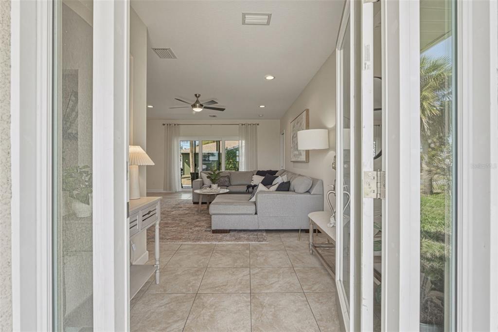 634 Carmel Road Venice, FL 34293 - Photo 2 of 67 a living room with furniture and a large window
