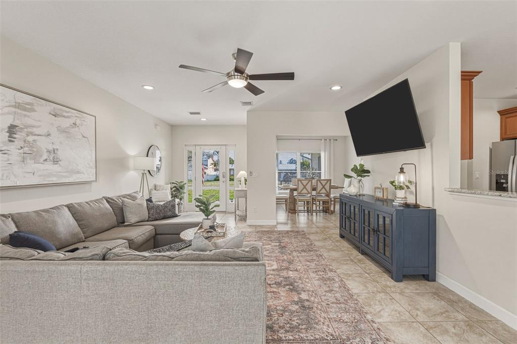 634 Carmel Road Venice, FL 34293 - Photo 22 of 67 a living room with furniture and a flat screen tv