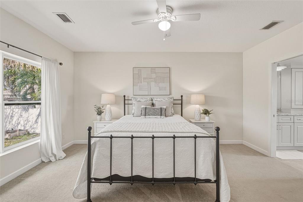 634 Carmel Road Venice, FL 34293 - Photo 23 of 67 a bedroom with a bed and a window