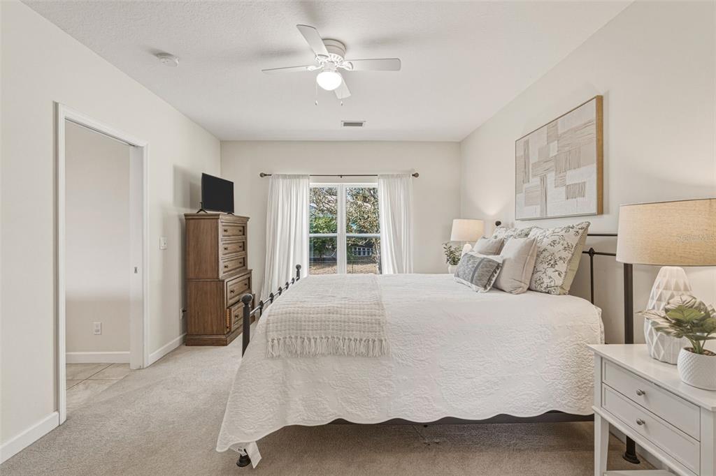 634 Carmel Road Venice, FL 34293 - Photo 26 of 67 a spacious bedroom with a bed and a window