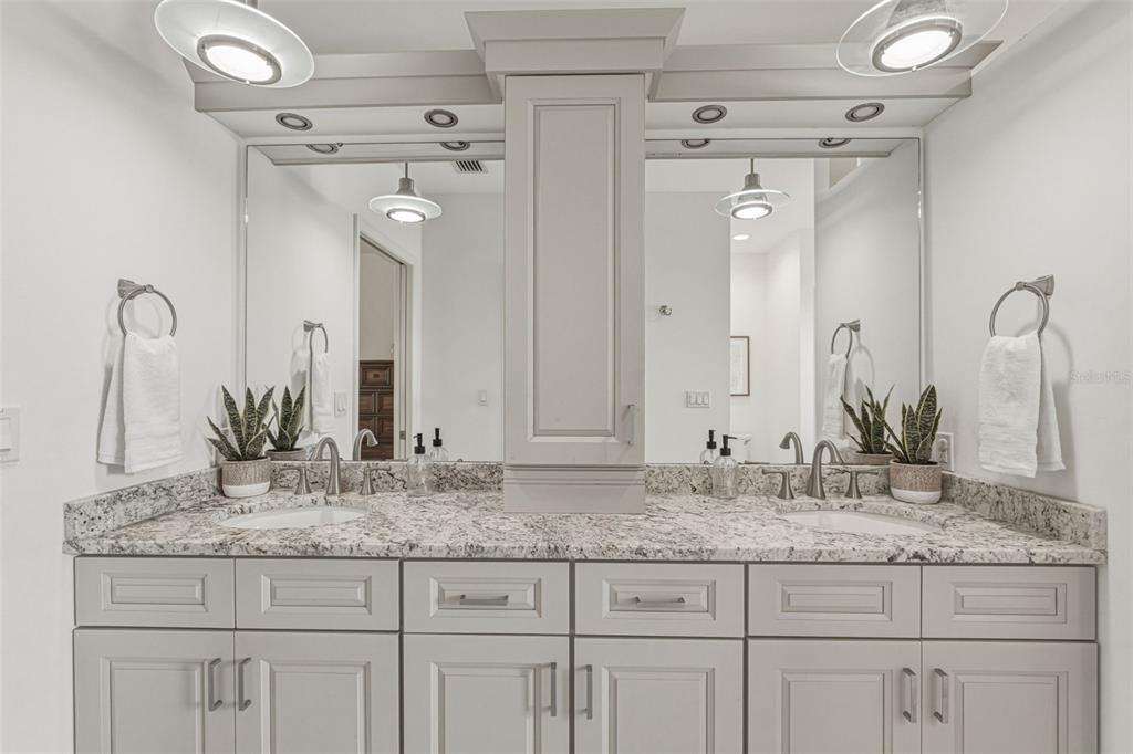 634 Carmel Road Venice, FL 34293 - Photo 31 of 67 a bathroom with sink granite and mirror