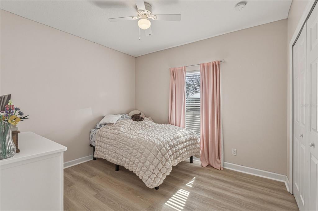 634 Carmel Road Venice, FL 34293 - Photo 33 of 67 a bedroom with a bed and a chandelier