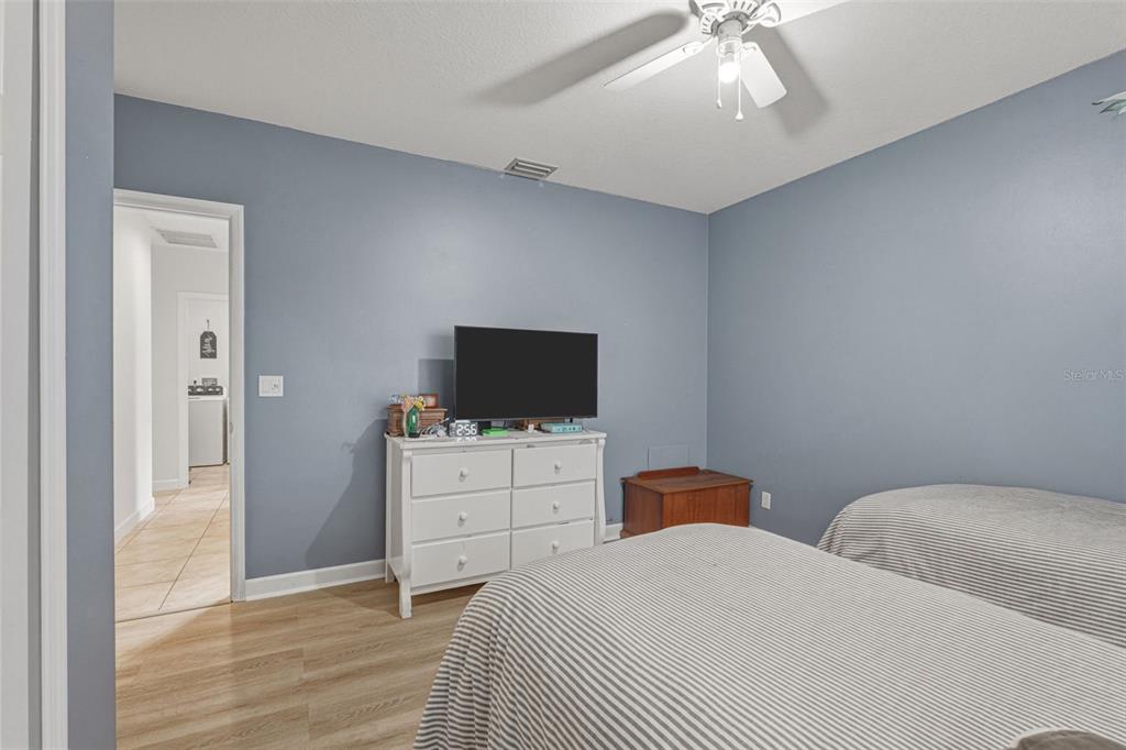 634 Carmel Road Venice, FL 34293 - Photo 37 of 67 a bedroom with two bed and a television