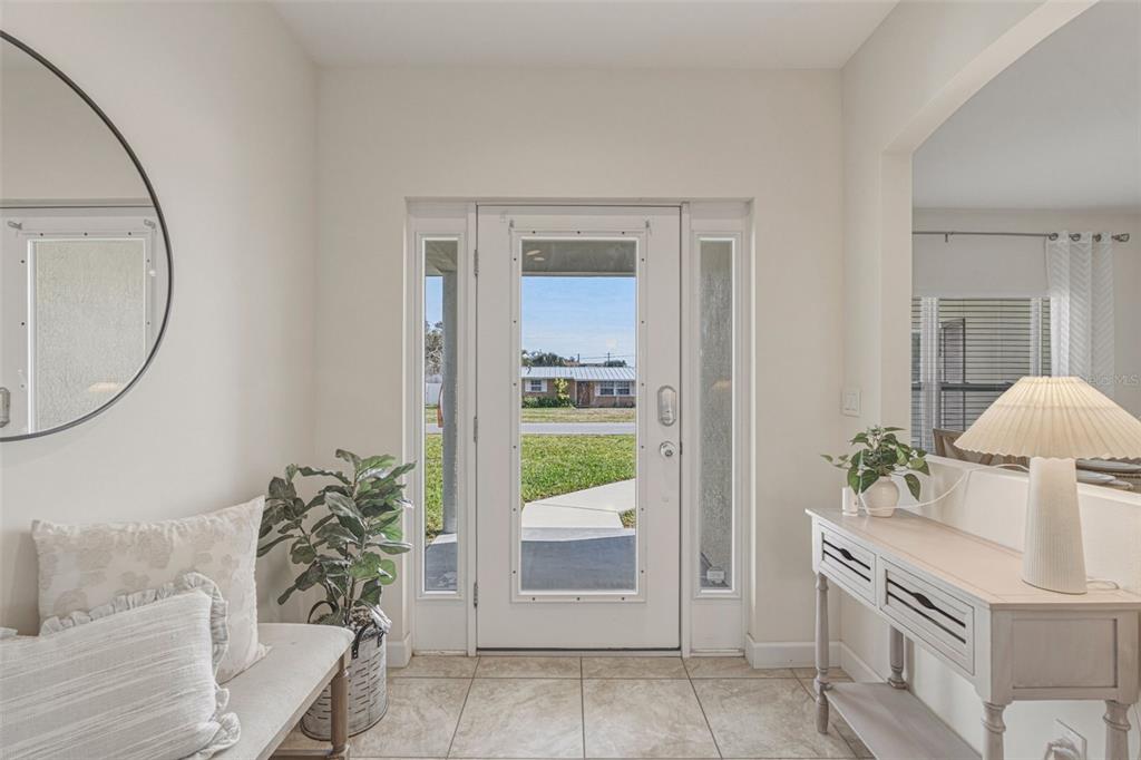 634 Carmel Road Venice, FL 34293 - Photo 5 of 67 wooden floor with a mirror and a sink