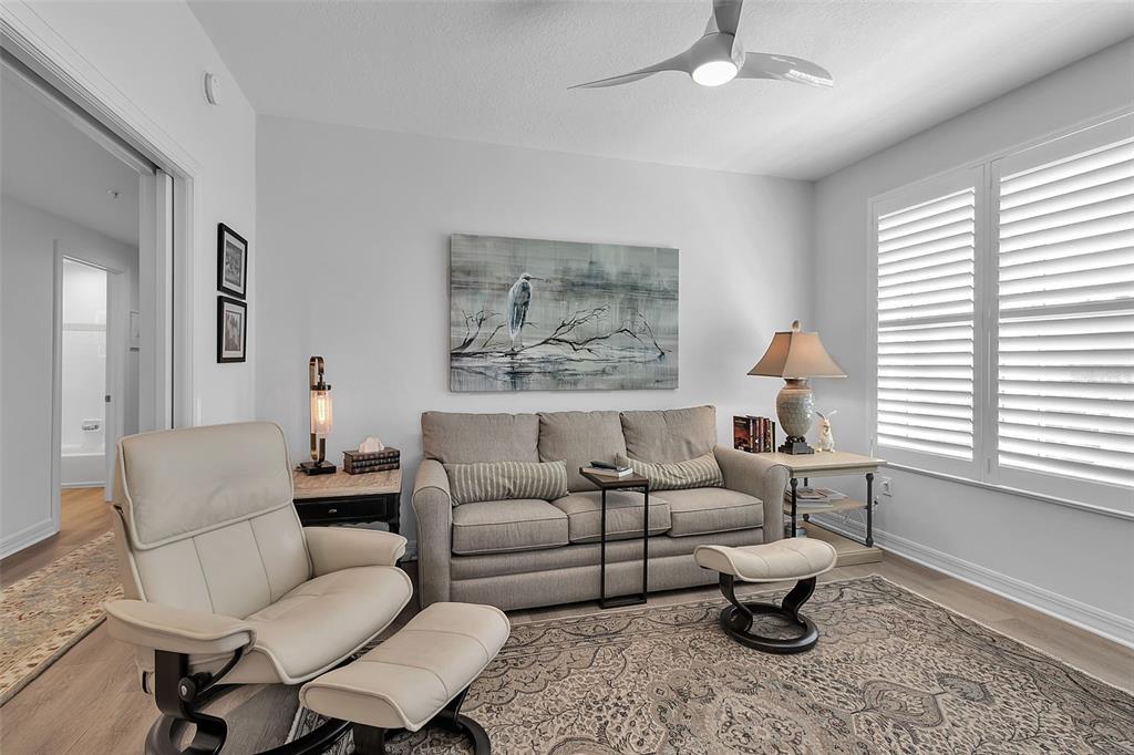 393 North Point Road, Unit 401 Osprey, FL 34229 - Photo 29 of 62 a living room with furniture a rug and a window