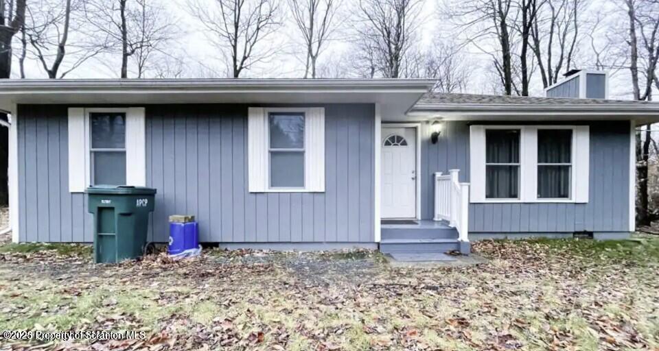 103 Orchard Lane Tobyhanna, PA 18466 - Photo 1 of 12 a view of a house with door and wooden fence