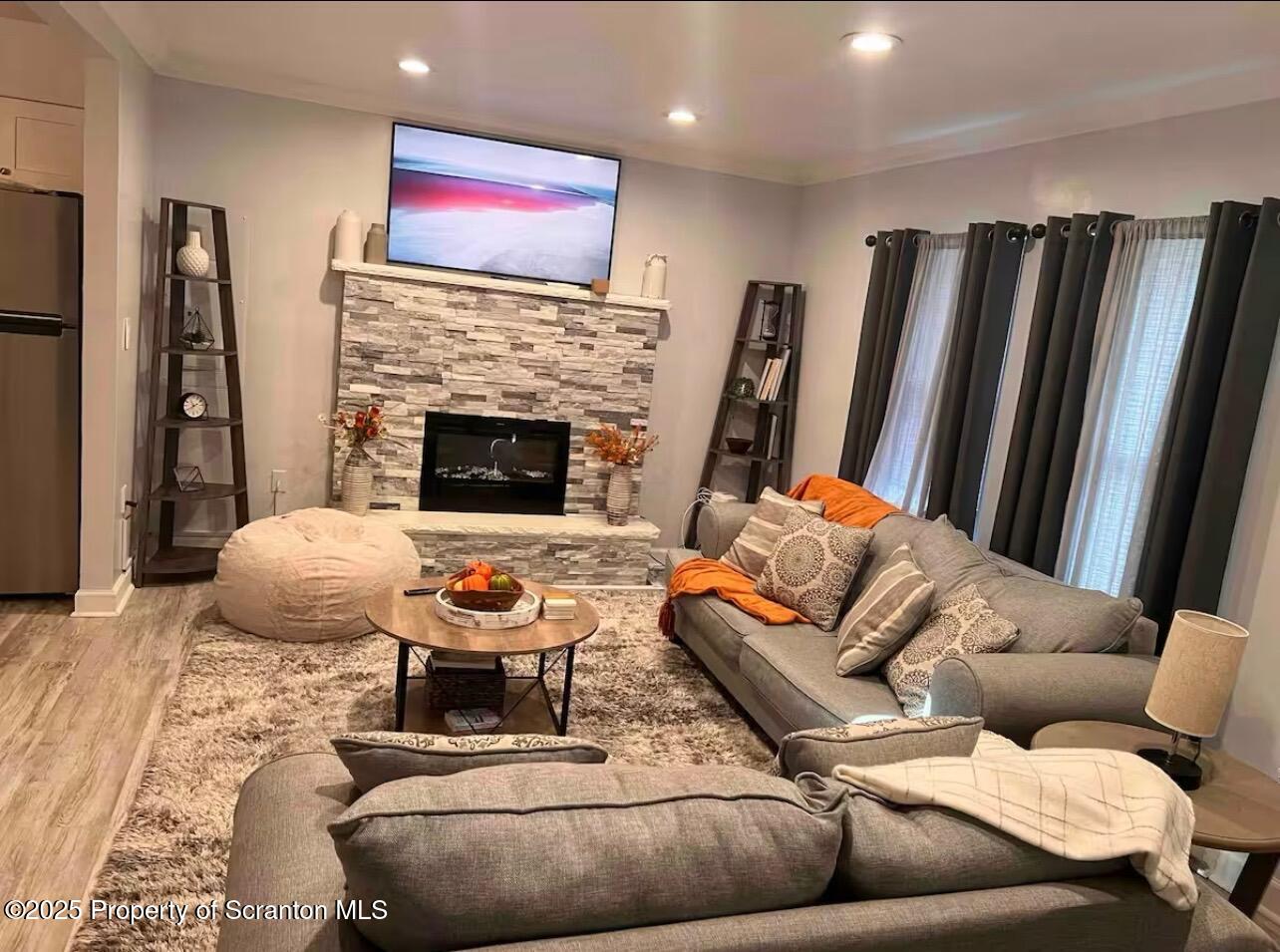 103 Orchard Lane Tobyhanna, PA 18466 - Photo 2 of 12 a living room with furniture and a fireplace