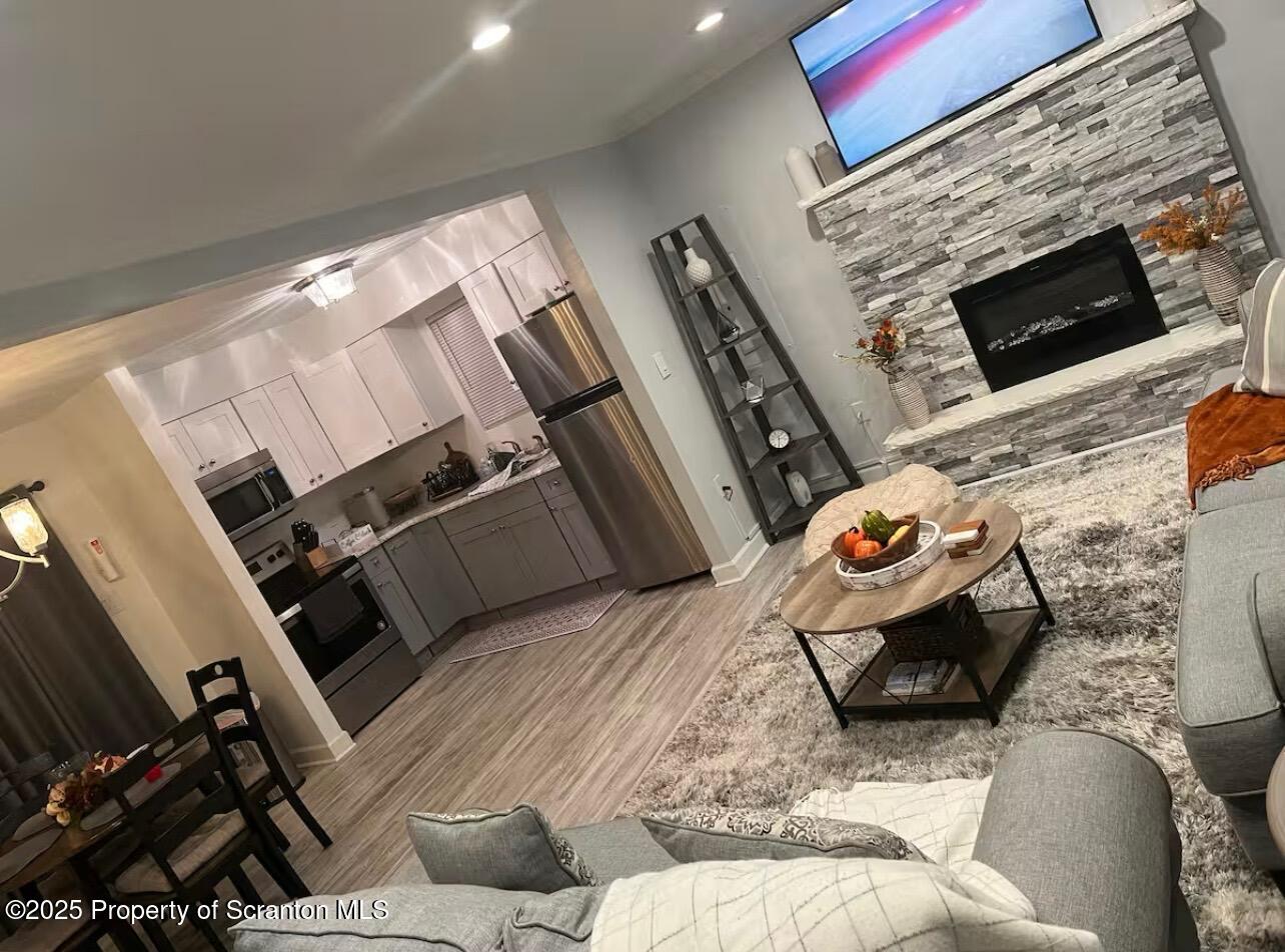 103 Orchard Lane Tobyhanna, PA 18466 - Photo 3 of 12 a bedroom with furniture and a fireplace