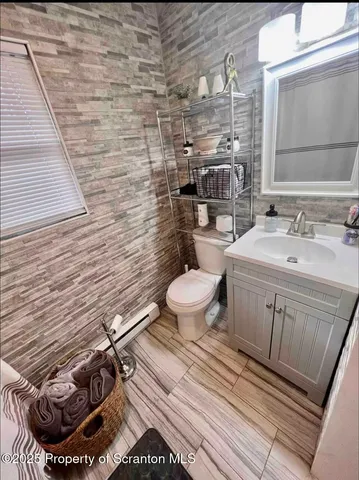 a bathroom with a toilet and a sink