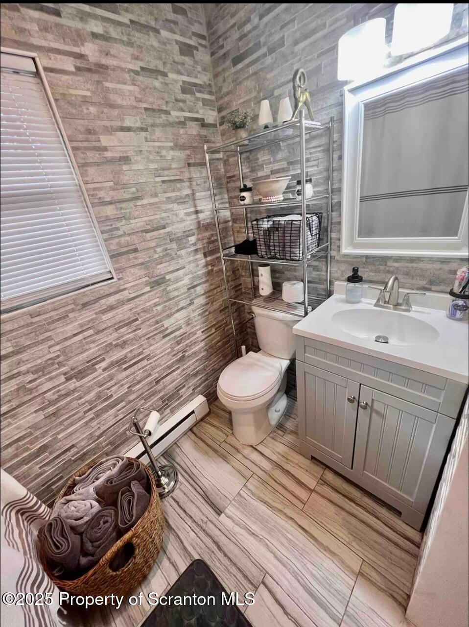 103 Orchard Lane Tobyhanna, PA 18466 - Photo 8 of 12 a bathroom with a toilet and a sink