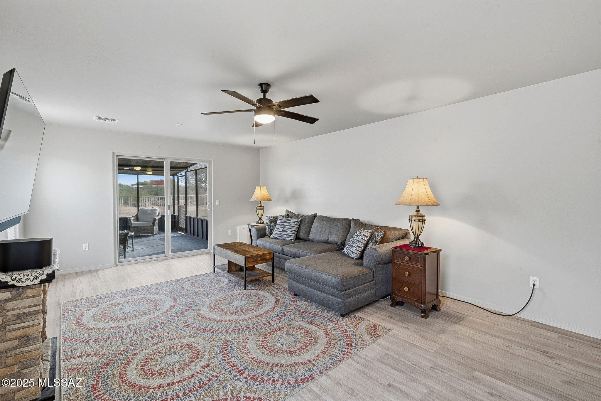 1458 North Wentworth Road Vail, AZ 85641 - Photo 34 of 44 a living room with furniture and a wooden floor