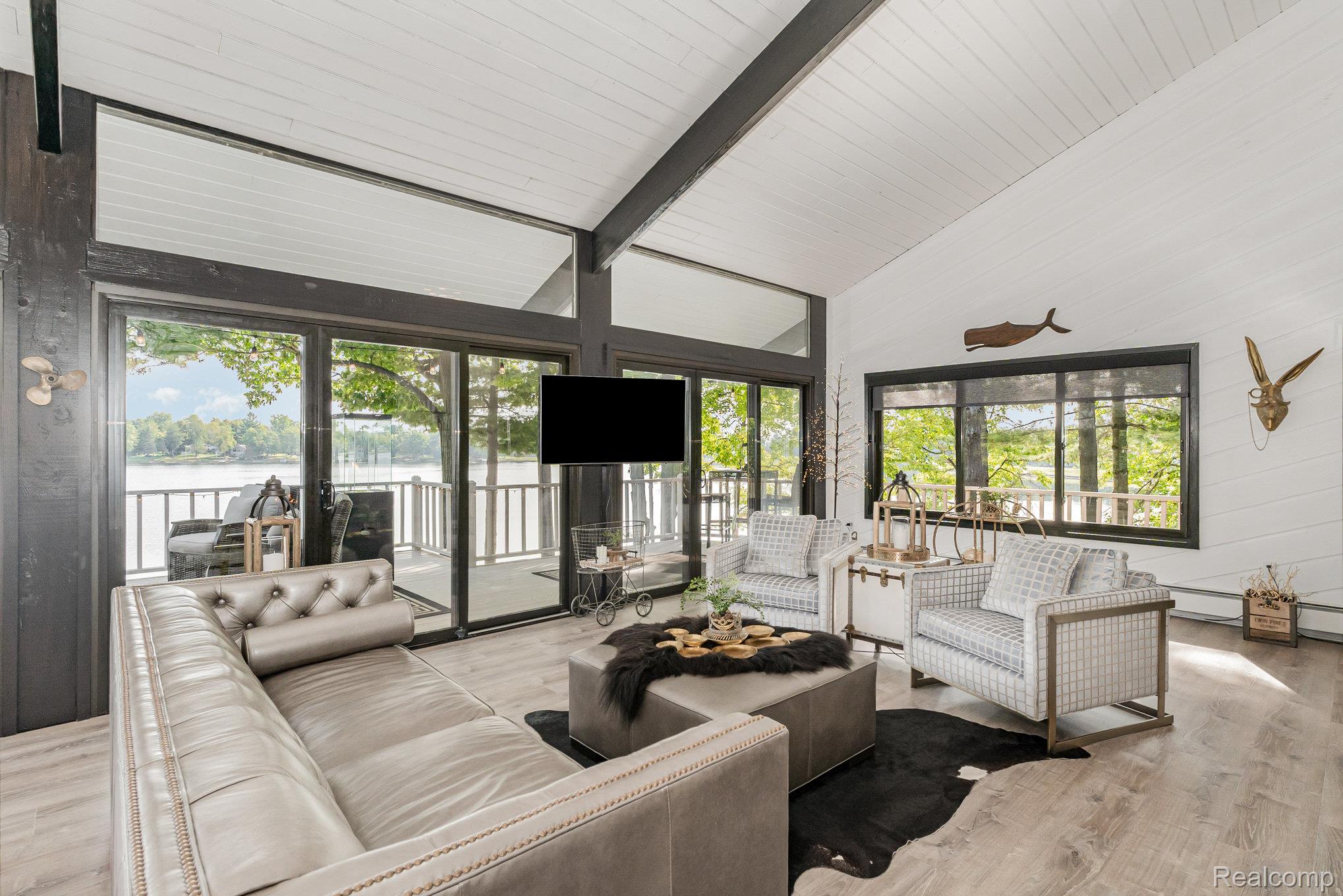2380 Islanders Way Gladwin, MI 48624 - Photo 15 of 48 Great Room to Deck w Lake Views all around