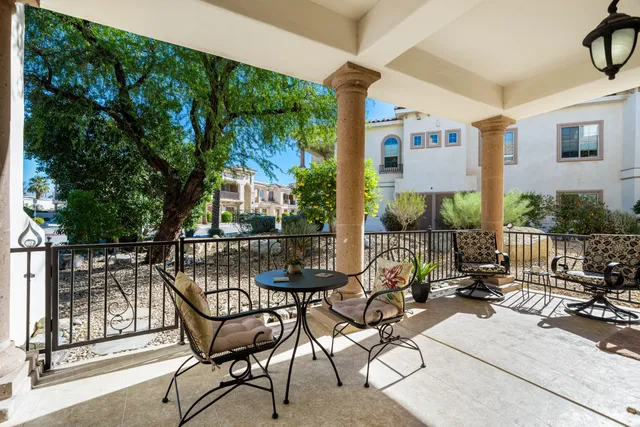 a view of a chairs and tables in patio