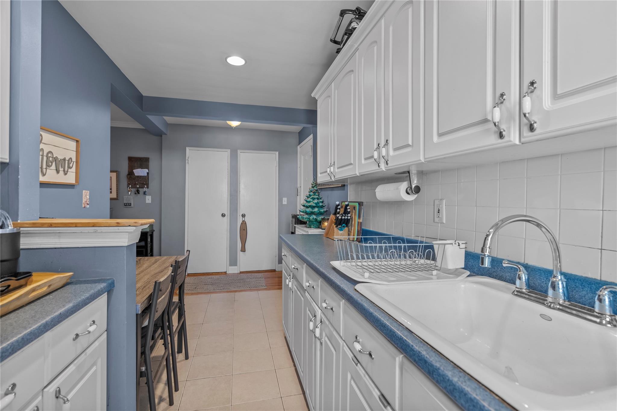 60 Locust Avenue, Unit 610 New Rochelle, NY 10801 - Photo 11 of 22 a kitchen with stainless steel appliances granite countertop a sink and cabinets