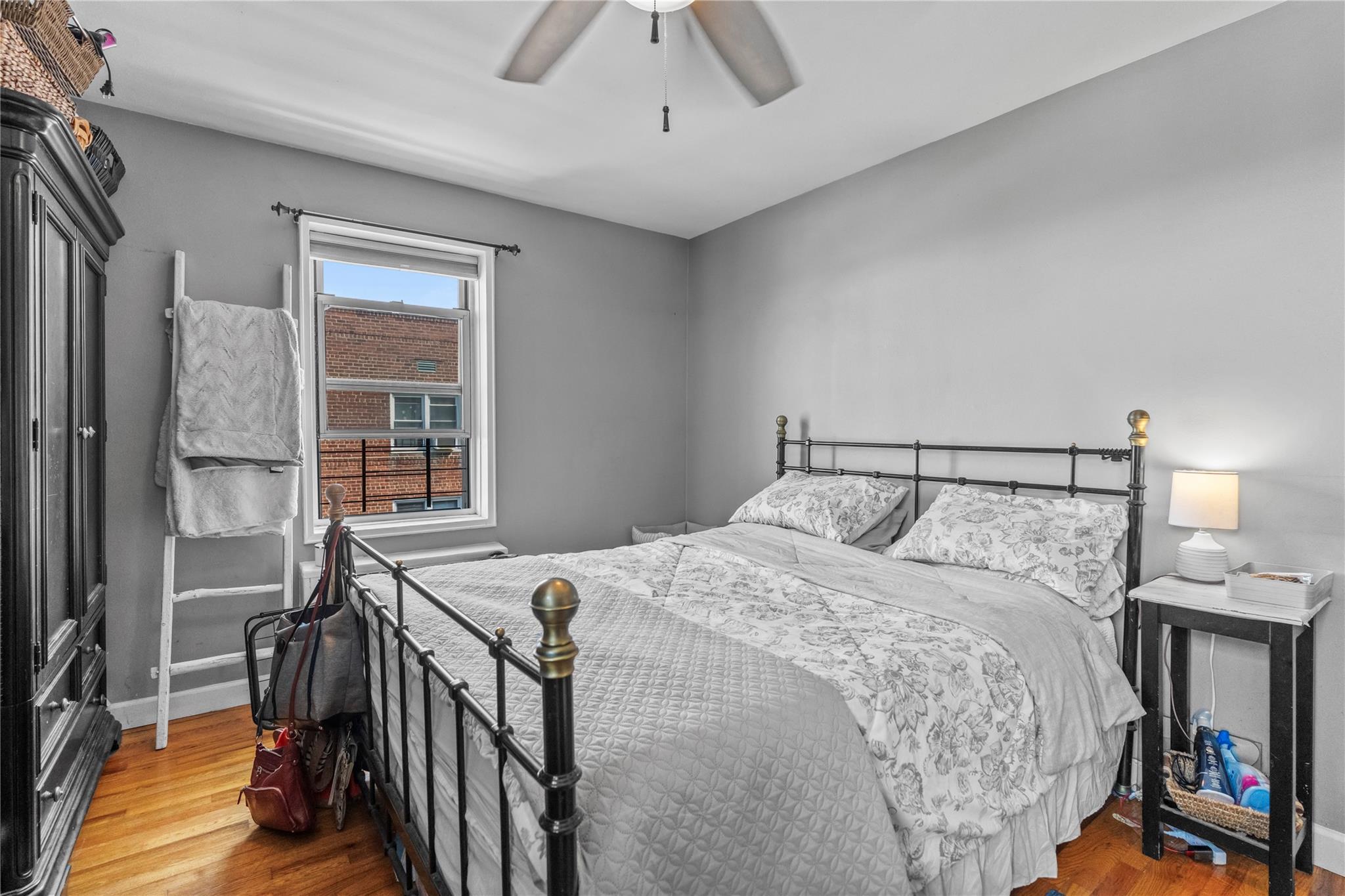 60 Locust Avenue, Unit 610 New Rochelle, NY 10801 - Photo 13 of 22 a bed sitting in a bedroom next to a window