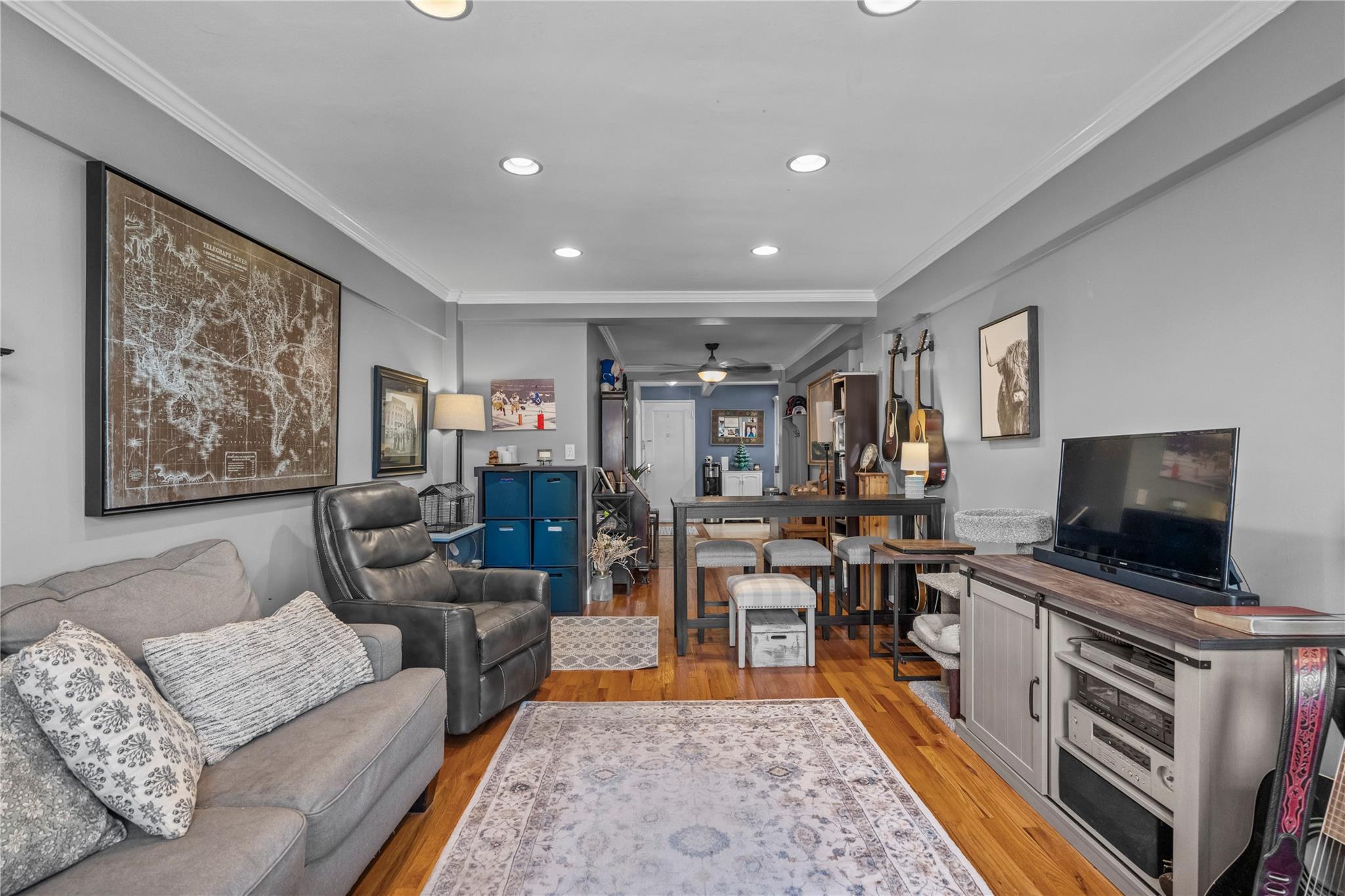60 Locust Avenue, Unit 610 New Rochelle, NY 10801 - Photo 5 of 22 a living room with furniture and a flat screen tv