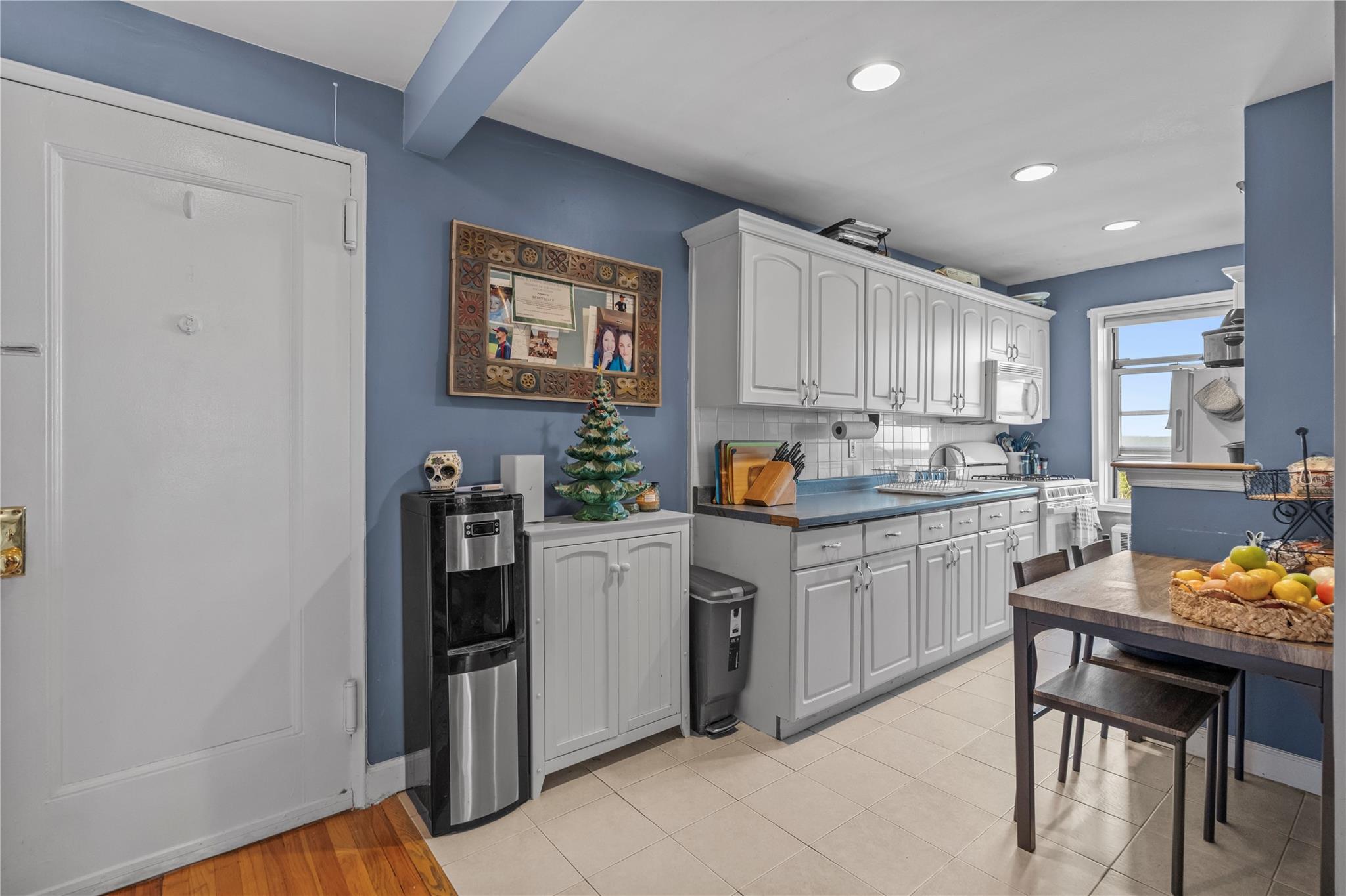 60 Locust Avenue, Unit 610 New Rochelle, NY 10801 - Photo 10 of 22 a kitchen with refrigerator cabinets and wooden floor