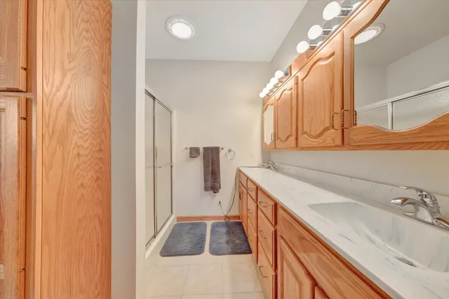 a bathroom with a sink and mirror