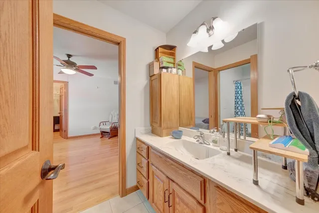 a bathroom with a sink double vanity granite and a mirror
