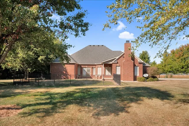 a backyard of a house with lots of green space