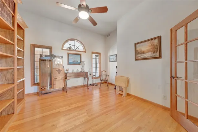 a view of a livingroom with furniture and a window