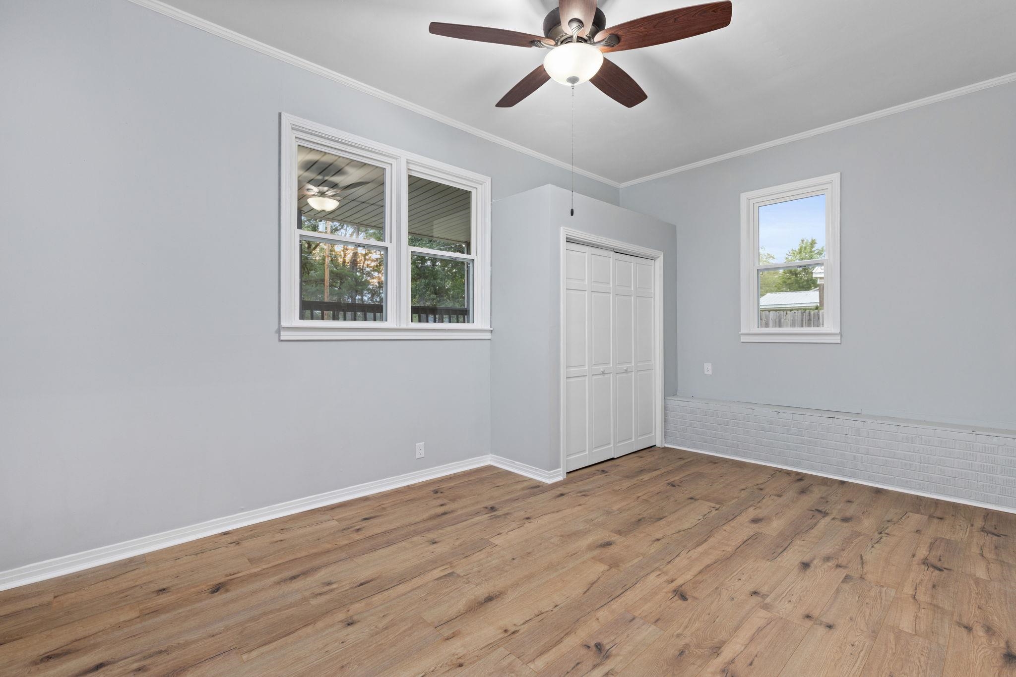 505 Mckewen Road Corinth, MS 38834 - Photo 12 of 39 a view of an empty room with wooden floor and a window