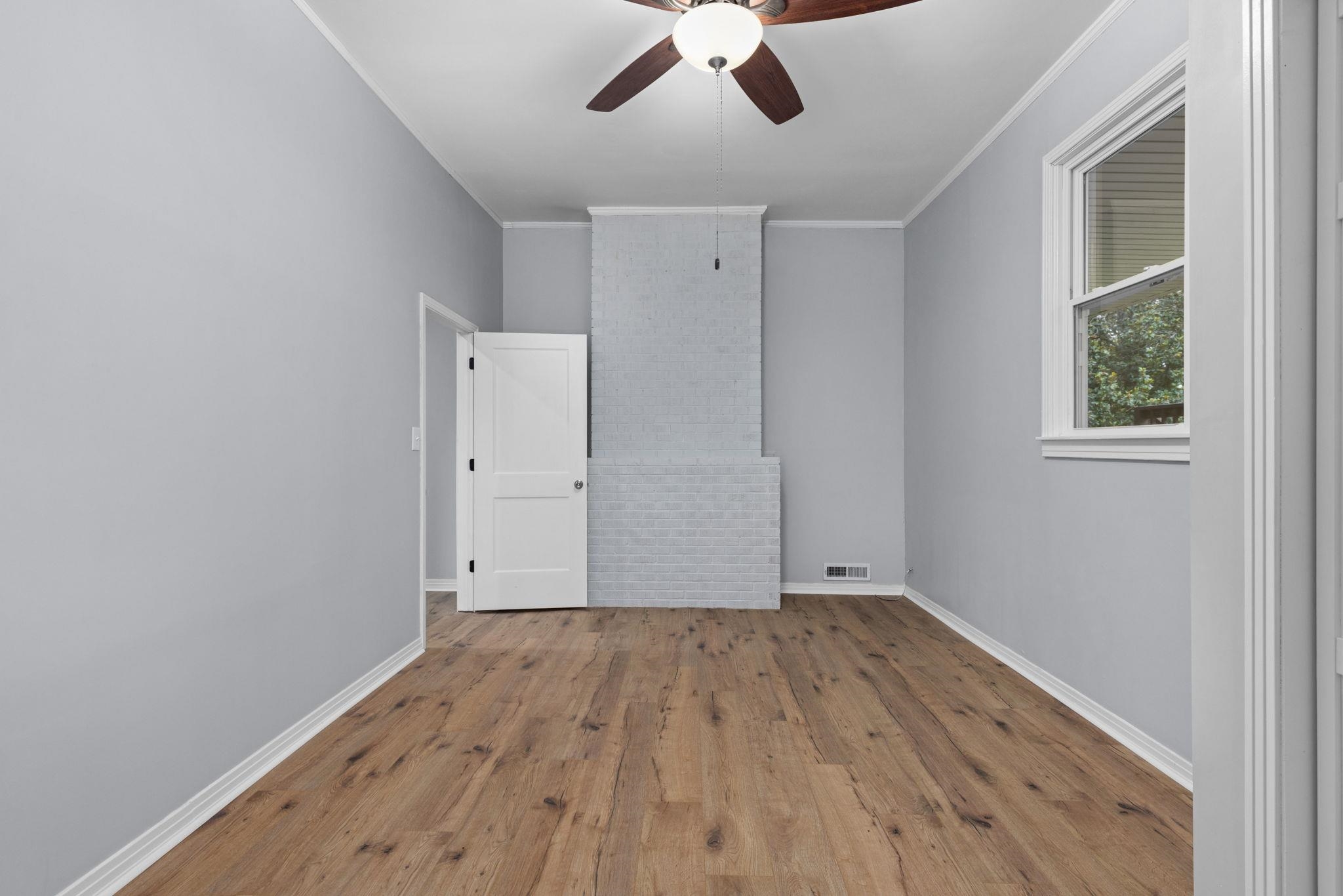 505 Mckewen Road Corinth, MS 38834 - Photo 13 of 39 wooden floor in an empty room with a window