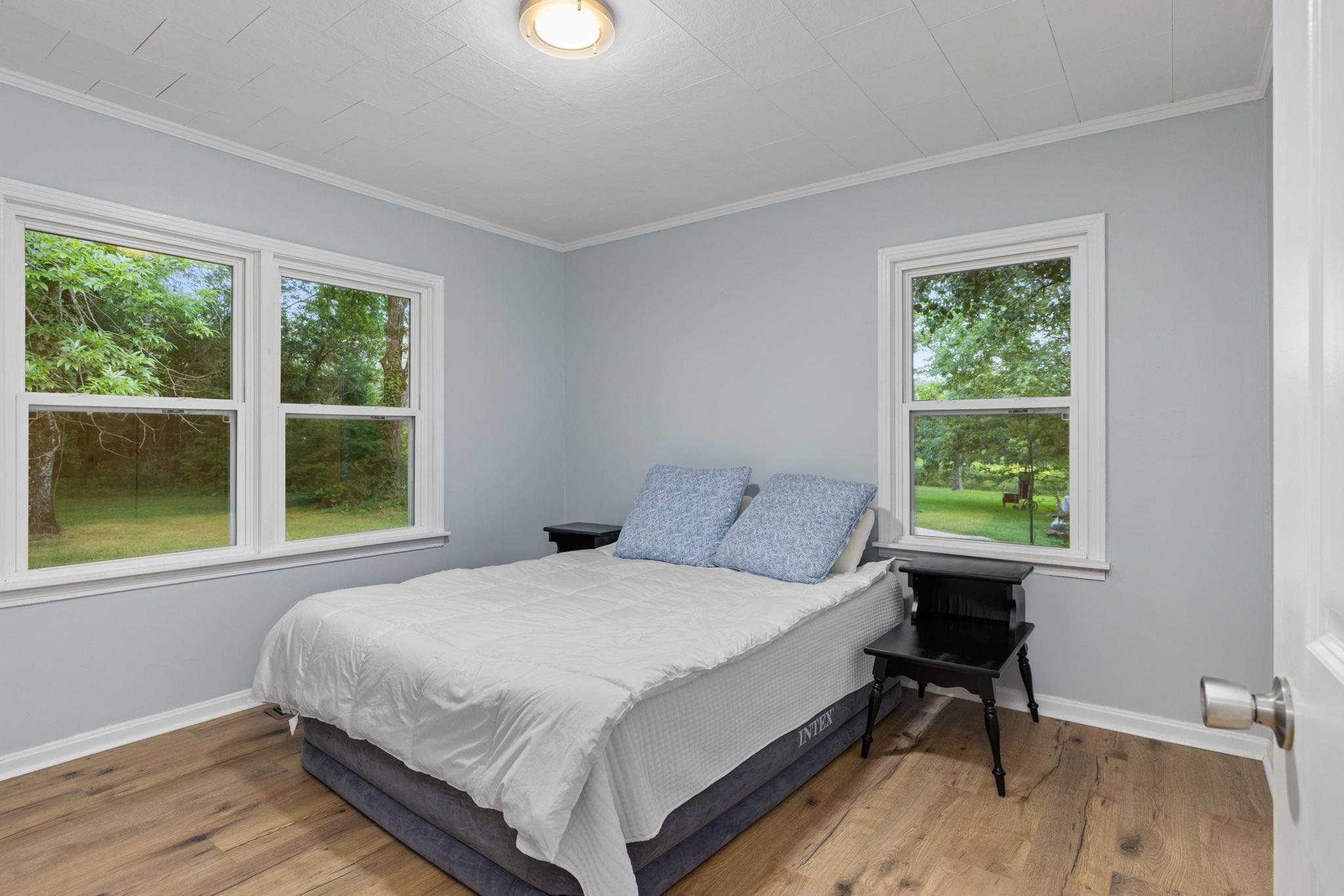 505 Mckewen Road Corinth, MS 38834 - Photo 14 of 39 a bedroom with a bed and a window