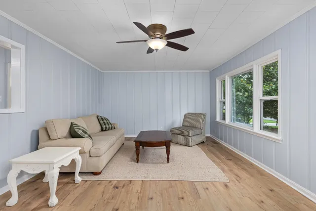 a living room with furniture and a window