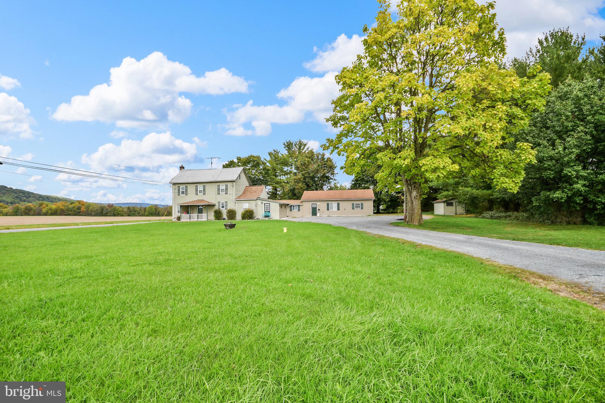 9604 Dry Bridge Road Emmitsburg, MD 21727 - Photo 3 of 11 a view of a house with a back yard
