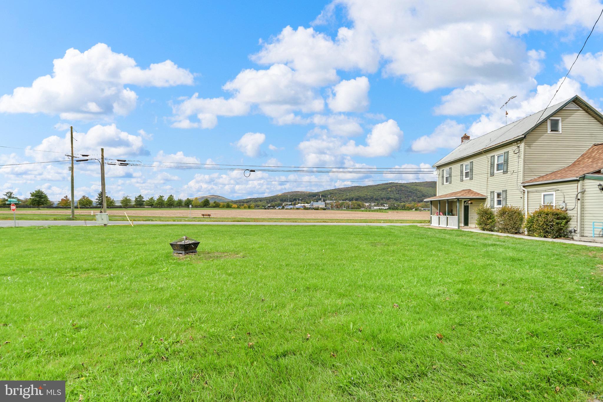 9604 Dry Bridge Road Emmitsburg, MD 21727 - Photo 4 of 11 a view of a big yard with table and chairs