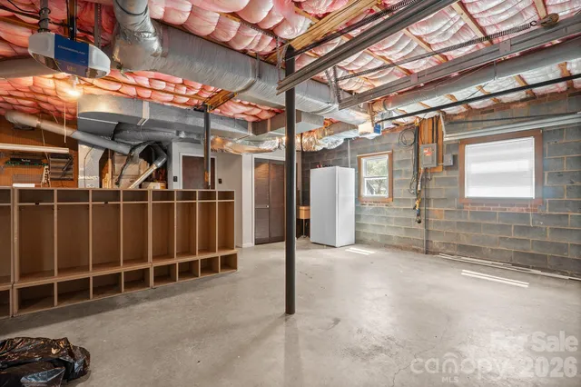 a view of a room with wooden walls