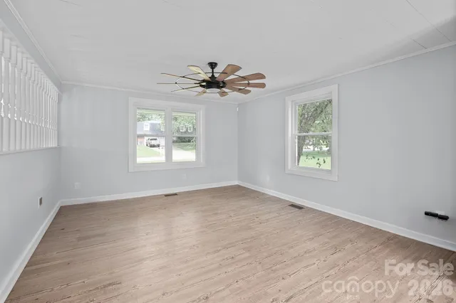 a view of an empty room with a window