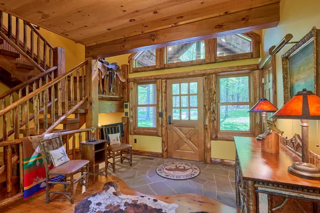 a view of a patio with couches table and chairs and potted plants