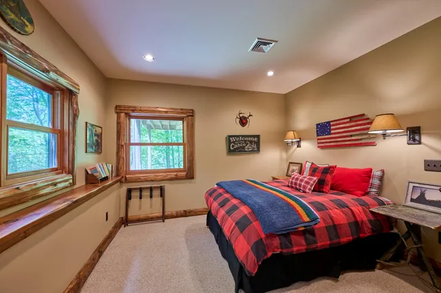 a spacious bedroom with a bed and window