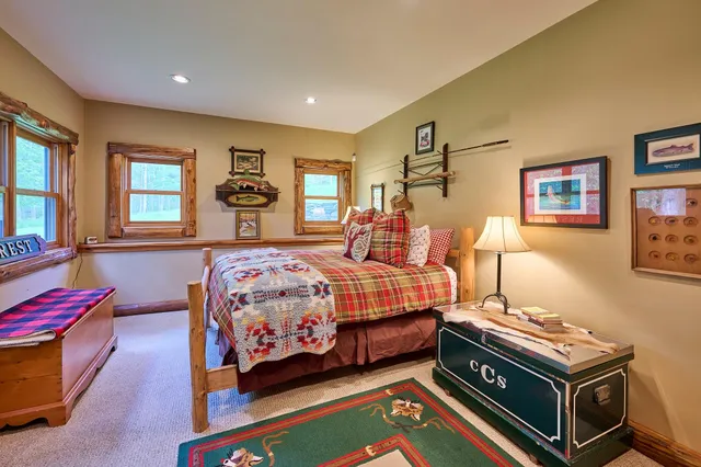 a bedroom with bed and window