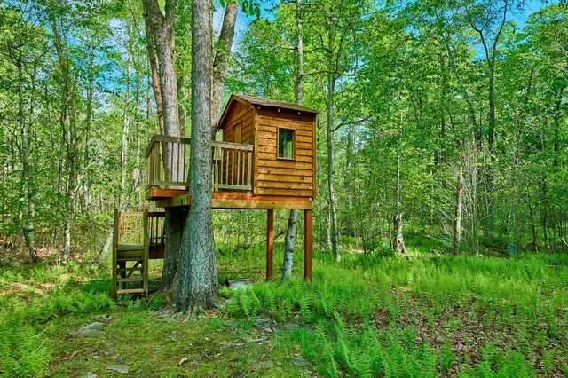 a view of a house with a small yard