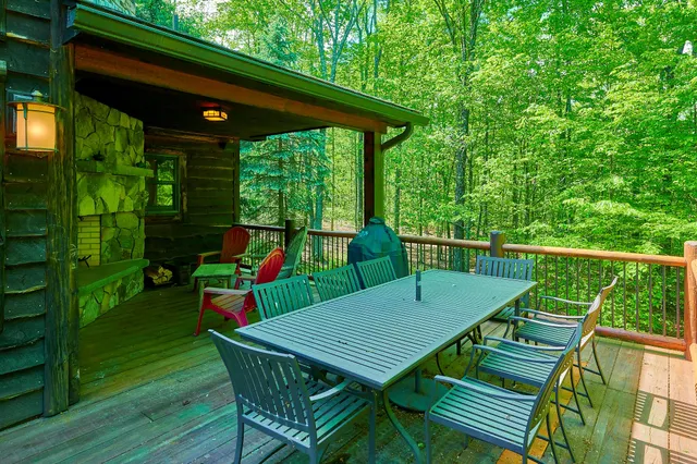 a view of a deck with a chair and table