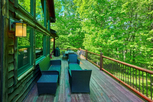 a view of balcony with yard and outdoor seating