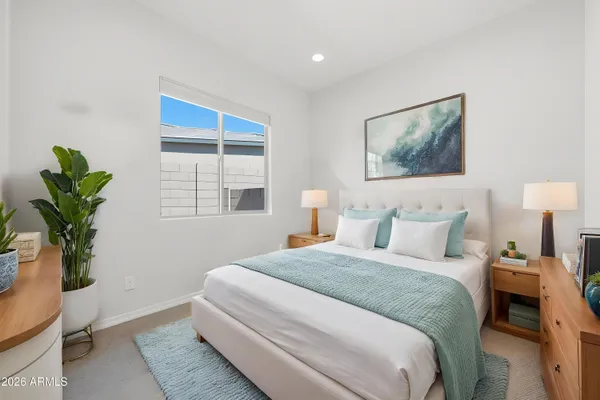 a view of walk in closet with clothes