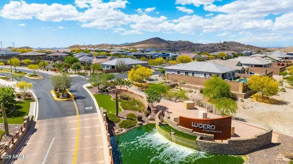 a living room with furniture wooden floor and a flat screen tv