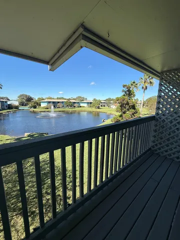 a view of balcony with furniture