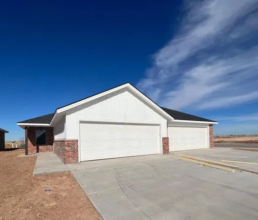 a view of garage and yard